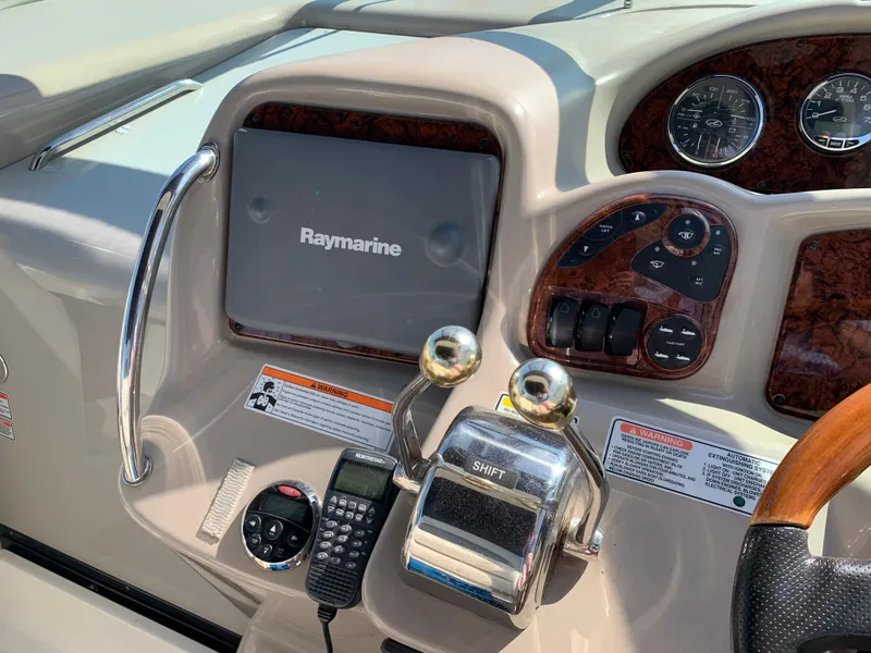 Slide: The Image of 2006 Sea Ray 340 Sundancer helm with Raymarine display and control panel. - 20