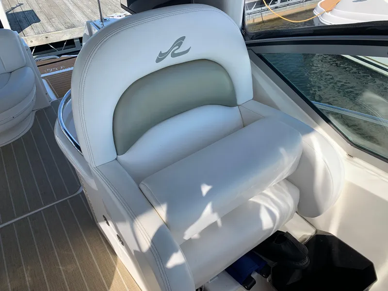 Slide: The Image of Luxury seating on a 2006 Sea Ray 340 Sundancer boat, featuring white upholstery. - 21