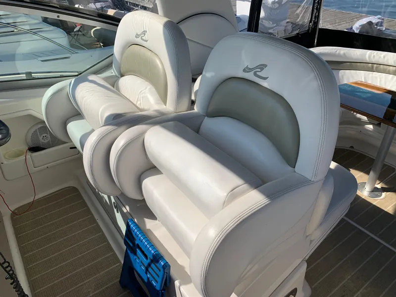 Slide: The Image of Luxury seating on 2006 Sea Ray 340 Sundancer yacht, featuring plush white upholstery. - 22