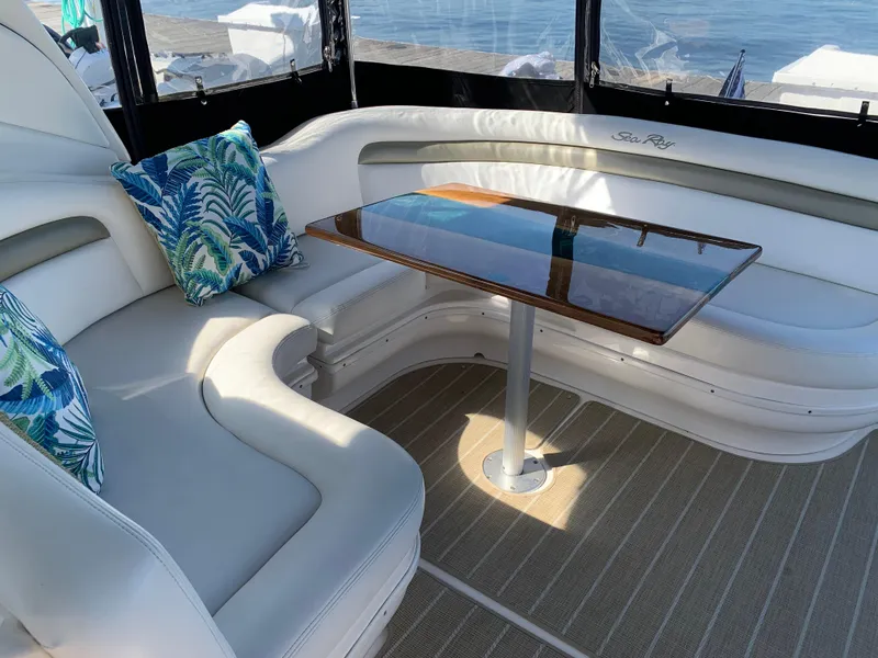 Slide: The Image of Luxurious interior of 2006 Sea Ray 340 Sundancer with elegant seating and table. - 23