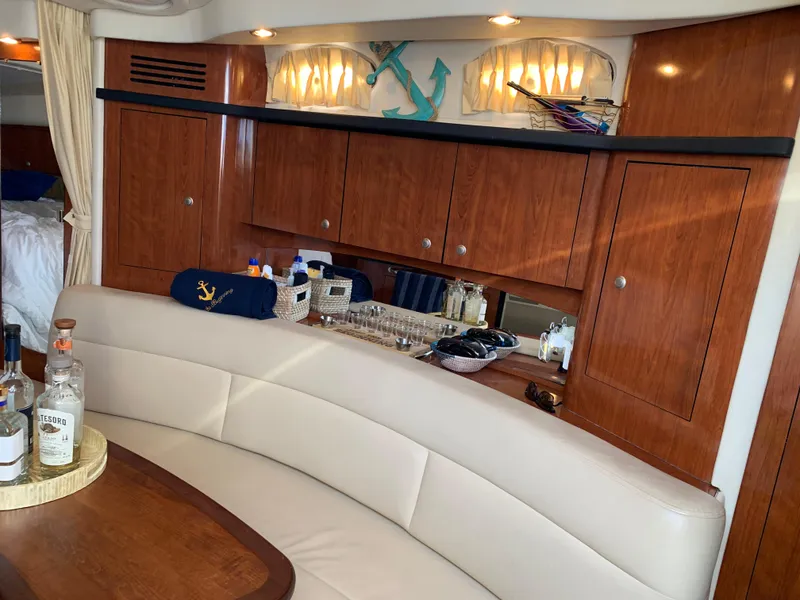 Slide: The Image of Luxurious interior of 2006 Sea Ray 340 Sundancer yacht with wooden cabinets and seating. - 28
