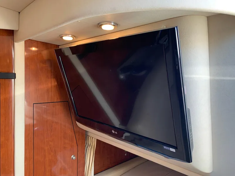 Slide: The Image of Flat-screen TV in 2006 Sea Ray 340 Sundancer cabin with wood paneling. - 37