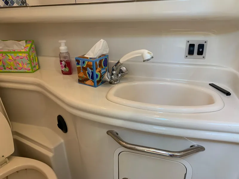 Slide: The Image of Bathroom sink area in a 2006 Sea Ray 340 Sundancer yacht. - 38