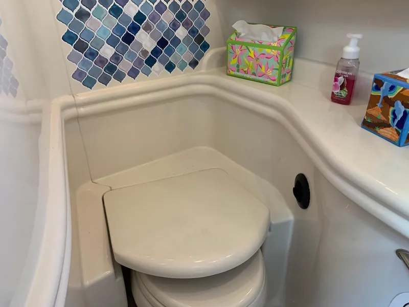 Slide: The Image of Compact bathroom in 2006 Sea Ray 340 Sundancer yacht with colorful tile accents. - 39