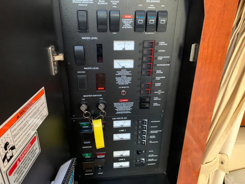 Slide: The Image of Electrical control panel of a 2006 Sea Ray 340 Sundancer boat. - 40