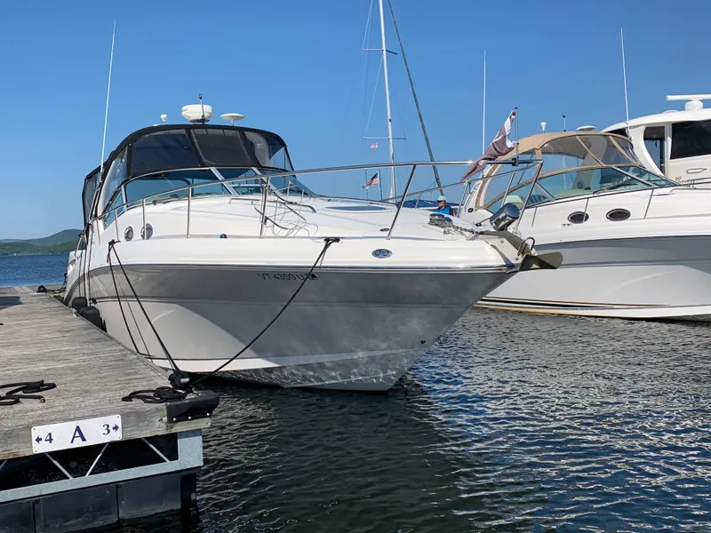 Slide: The Image of 2006 Sea Ray 340 Sundancer docked at a marina on a sunny day. - 6