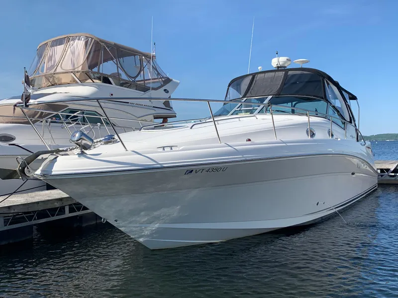 Slide: The Image of 2006 Sea Ray 340 Sundancer yacht docked on a sunny day. - 8