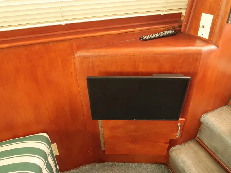 Slide: The Image of Interior of 1994 Hatteras 42 Cockpit Motor Yacht with TV and remote control. - 20