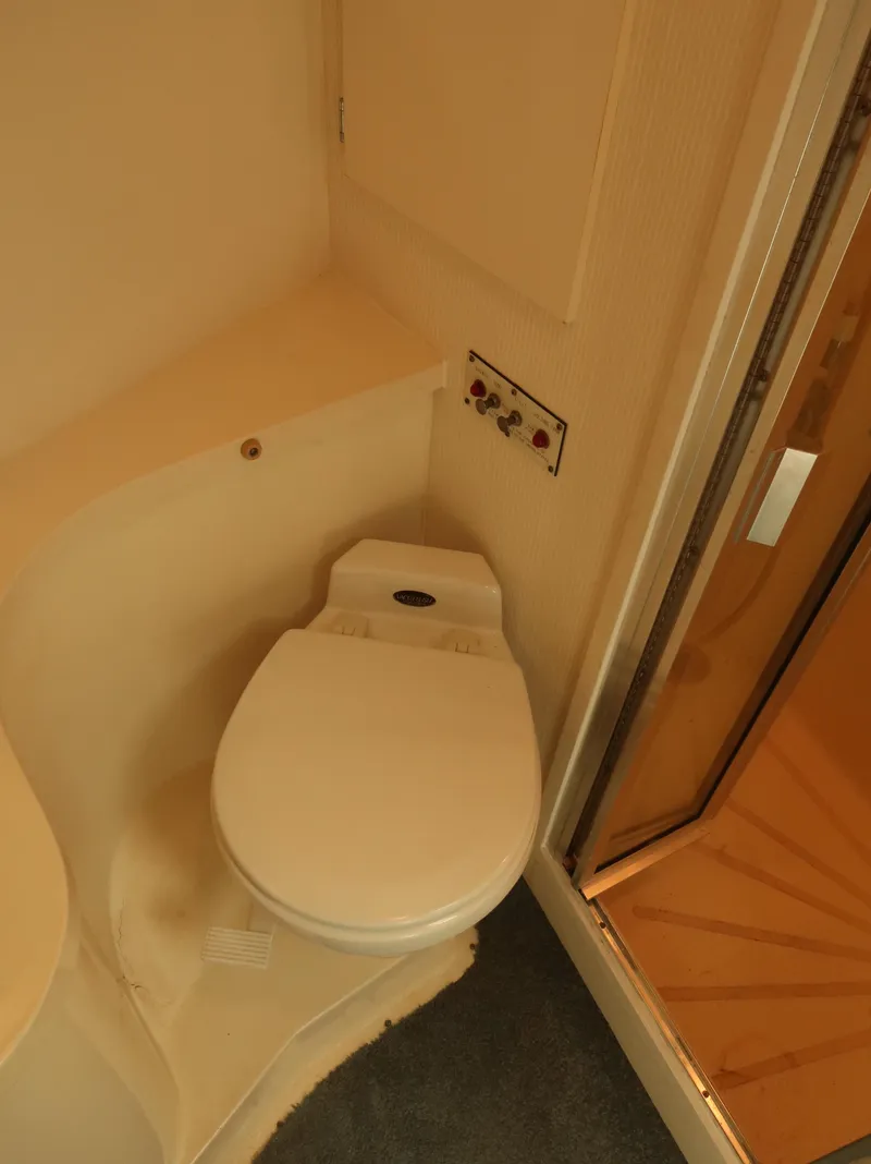 Slide: The Image of Toilet area in 1994 Hatteras 42 Cockpit Motor Yacht bathroom. - 21