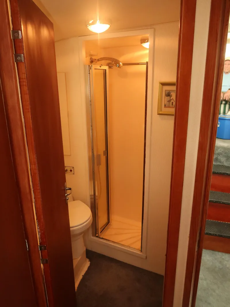Slide: The Image of Bathroom interior of 1994 Hatteras 42 Cockpit Motor Yacht with shower and toilet. - 31