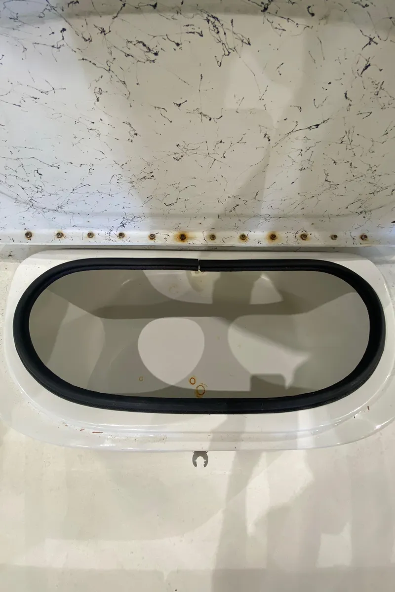 Slide: The Image of Open storage compartment in 2000 Triton 18 Sea Flight boat. - 12