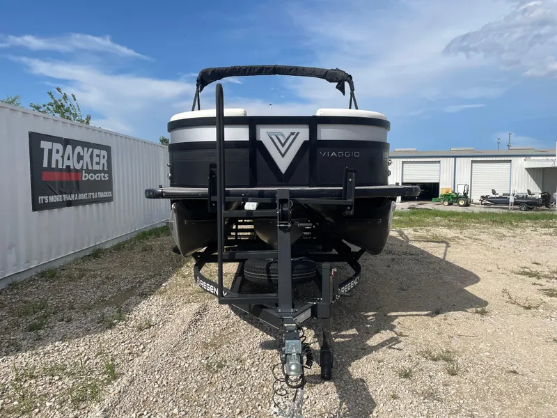 Slide: The Image of 2022 Misty Harbor Diamante Series boat on trailer, parked outdoors under blue sky. - 5