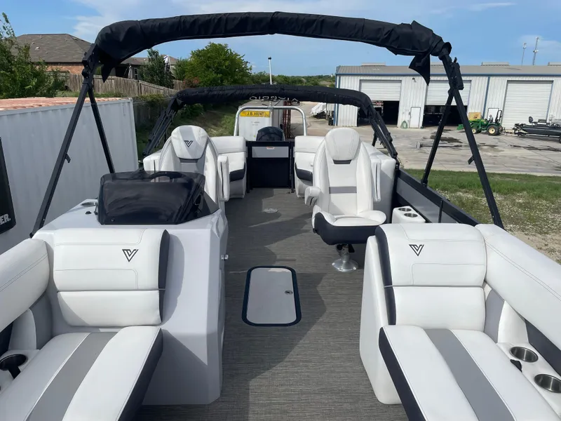 Slide: The Image of 2022 Misty Harbor Diamante Series pontoon boat with white seating and black canopy. - 7