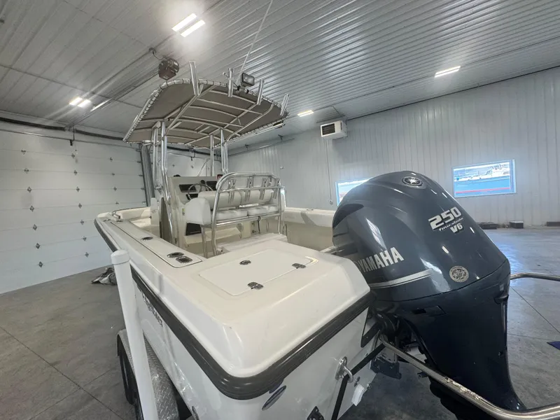 Slide: The Image of 2011 Edgewater 228CC boat with Yamaha 250 V6 engine in a garage. - 17
