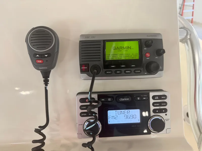 Slide: The Image of Garmin VHF 100 radio and Clarion audio system on 2011 Edgewater 228CC boat. - 24