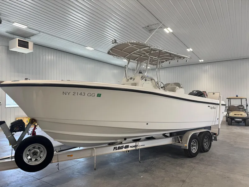 Slide: The Image of 2011 Edgewater 228CC boat on trailer in indoor storage facility. - 4