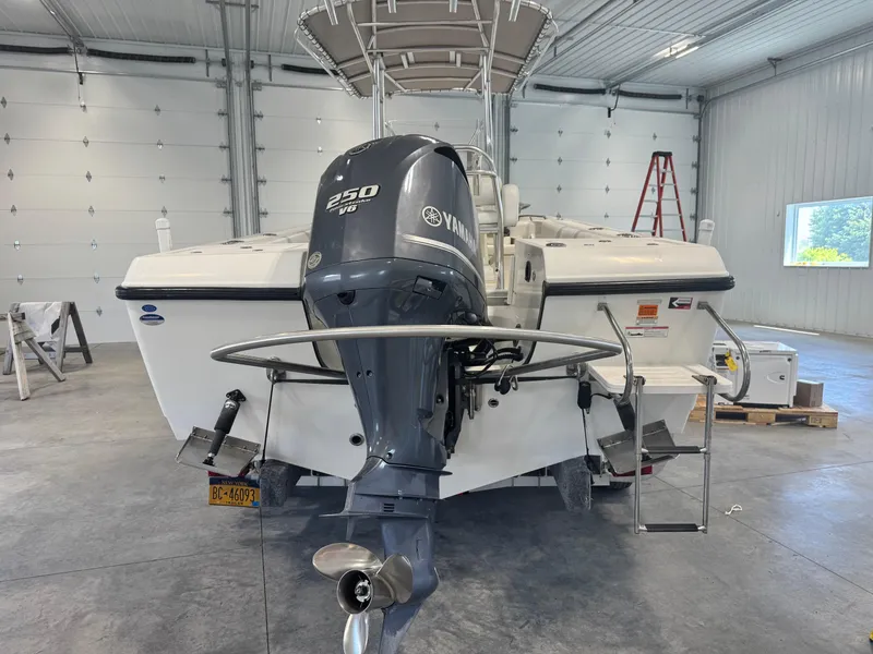 Slide: The Image of 2011 Edgewater 228CC boat with Yamaha 250 V6 engine in a garage. - 5