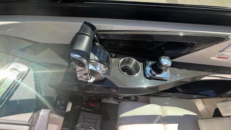 Slide: The Image of Control panel of a 2014 Monterey 328 Super Sport boat with throttle and joystick. - 13