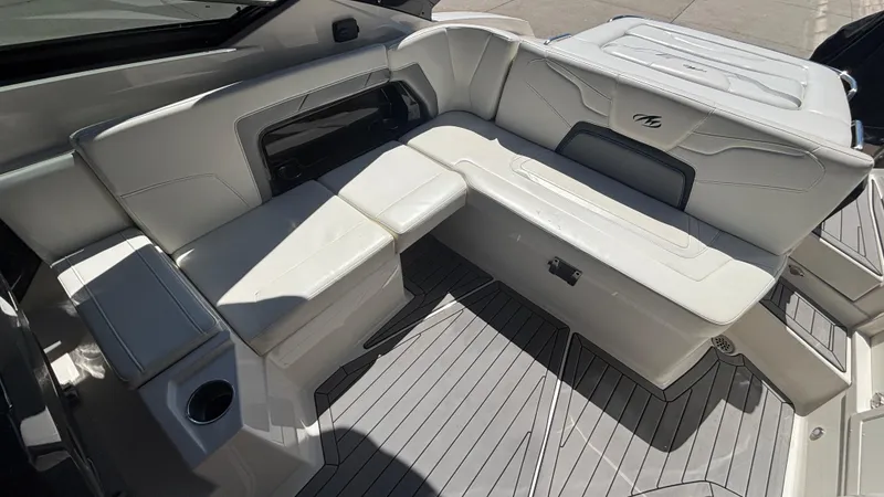 Slide: The Image of Luxurious seating area on a 2014 Monterey 328 Super Sport boat with white upholstery. - 17