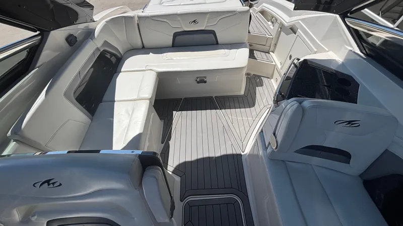 Slide: The Image of 2014 Monterey 328 Super Sport boat interior with white seating and sleek design. - 19