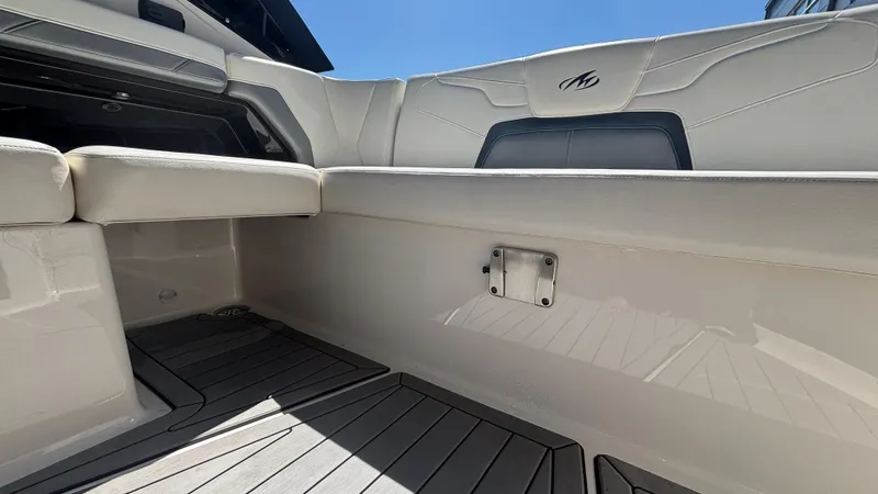 Slide: The Image of Interior view of a 2014 Monterey 328 Super Sport boat with white seating and sleek design. - 20