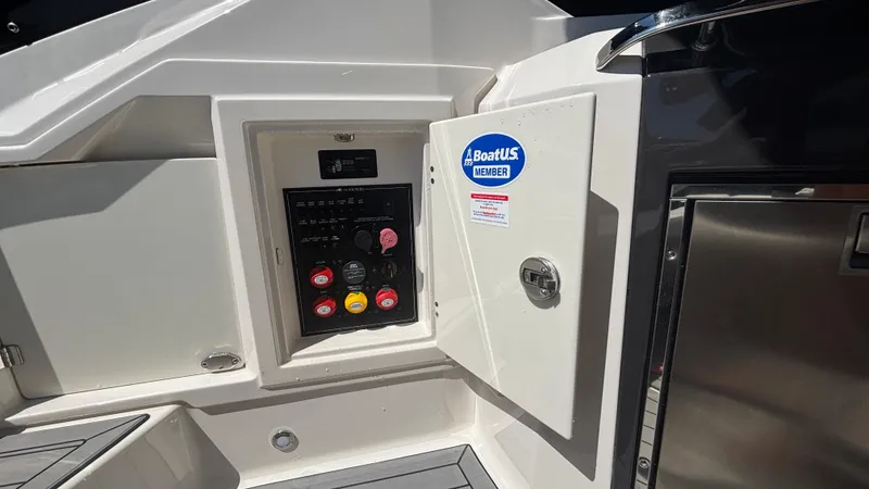 Slide: The Image of 2014 Monterey 328 Super Sport boat control panel with BoatUS Member sticker. - 22