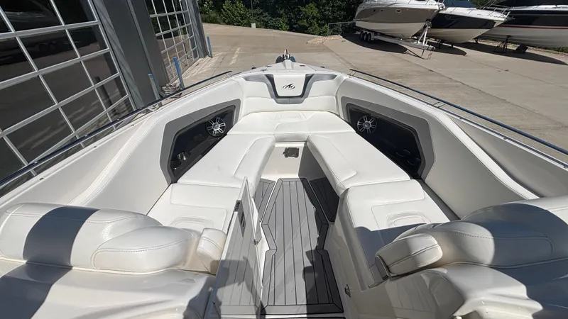Slide: The Image of 2014 Monterey 328 Super Sport boat interior with white seating and modern design. - 24