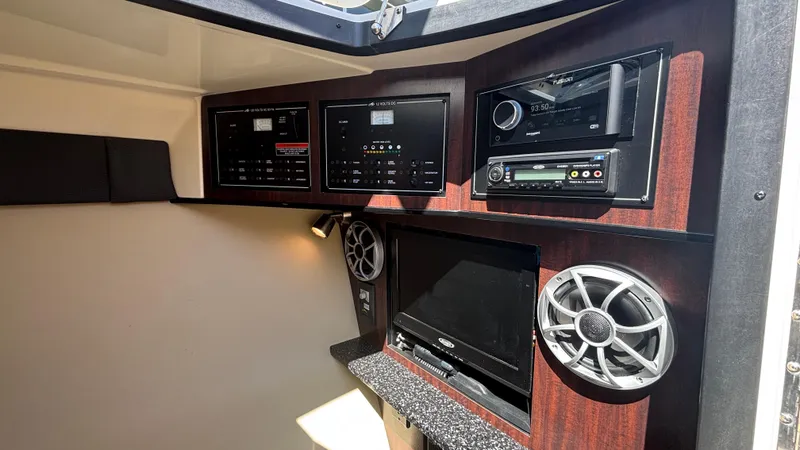 Slide: The Image of Interior of 2014 Monterey 328 Super Sport with control panels and audio system. - 25