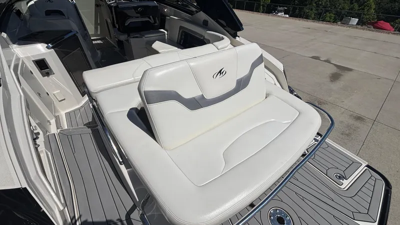 Slide: The Image of 2014 Monterey 328 Super Sport boat interior with white seating and sleek design. - 39
