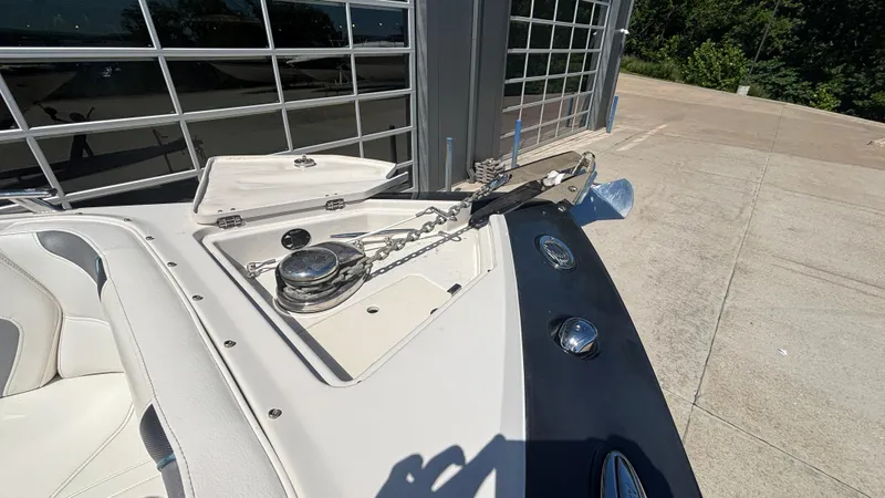 Slide: The Image of 2014 Monterey 328 Super Sport boat anchor and chain mechanism on deck. - 4