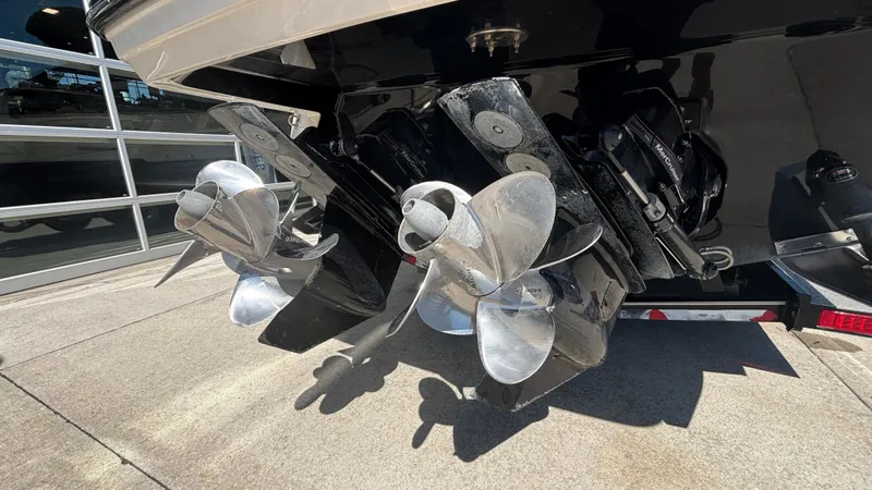 Slide: The Image of 2014 Monterey 328 Super Sport boat propellers and stern drive in a showroom. - 7