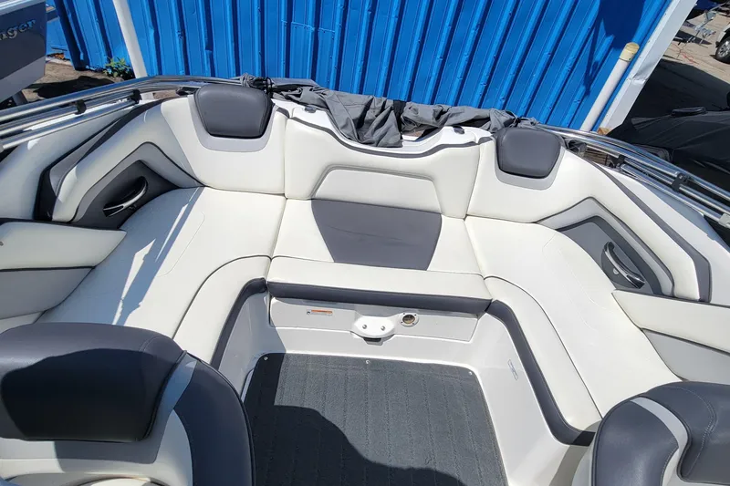 Slide: The Image of 2016 Yamaha Boats SX192 interior with white and gray seating, blue background. - 4
