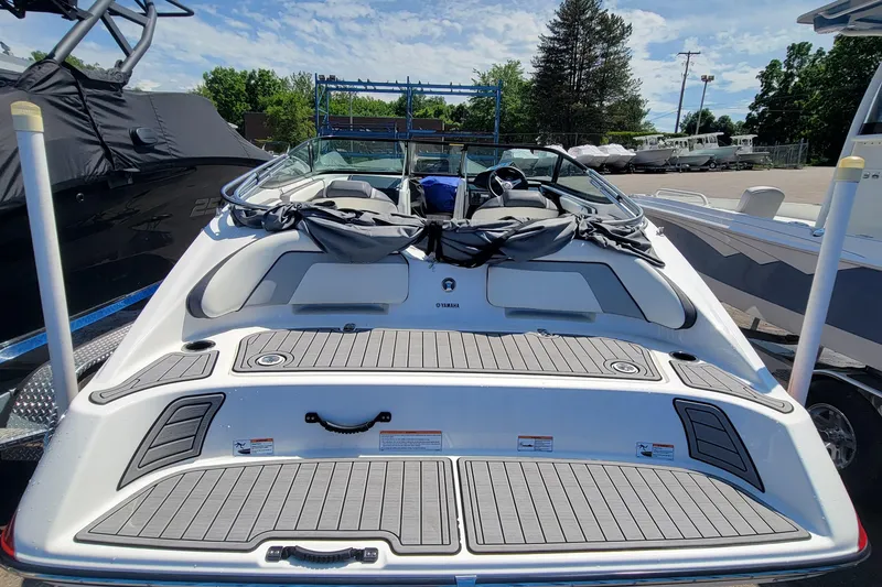 Slide: The Image of 2016 Yamaha Boats SX192, rear view, parked outdoors on a sunny day. - 5