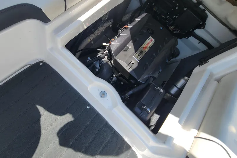 Slide: The Image of Engine compartment of a 2016 Yamaha Boats SX192, showcasing internal components and layout. - 6