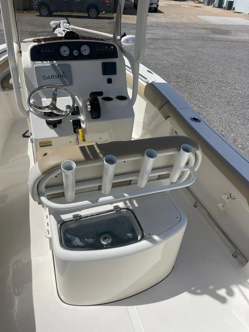 Slide: The Image of 2019 Pioneer 202 Sportfish boat interior with Garmin system and rod holders. - 17