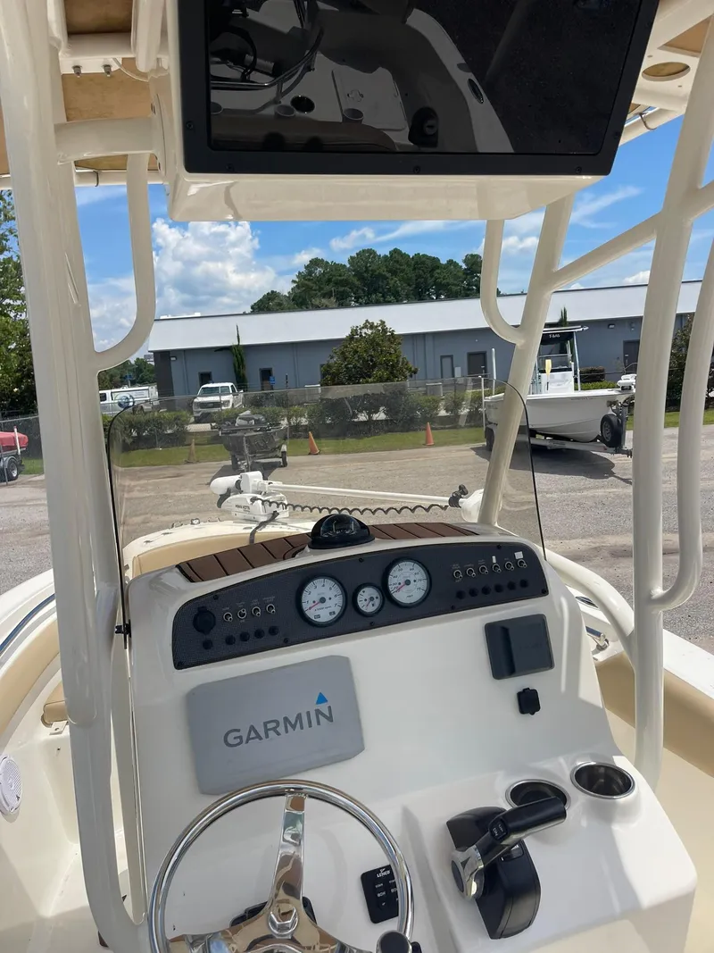 Slide: The Image of 2019 Pioneer 202 Sportfish boat dashboard with Garmin navigation system. - 2