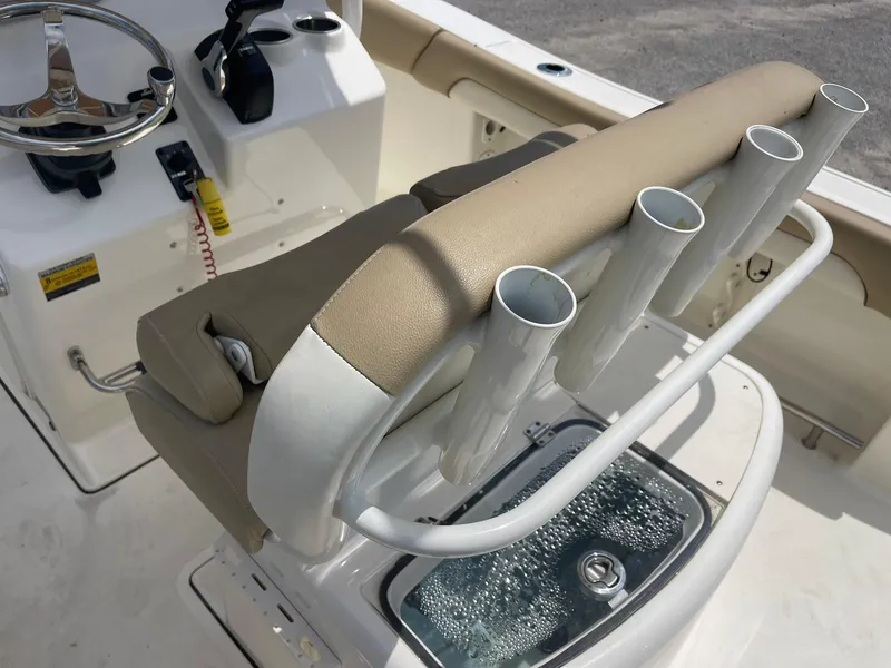 Slide: The Image of 2019 Pioneer 202 Sportfish boat interior with rod holders and steering console. - 4