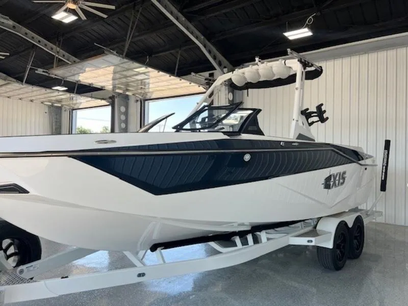 Slide: The Image of 2024 Axis T250 boat in a showroom, featuring sleek design and modern features. - 4