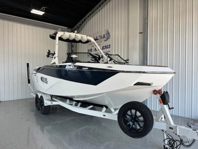 Slide: The Image of 2024 Axis T250 boat on trailer in indoor showroom. - 5