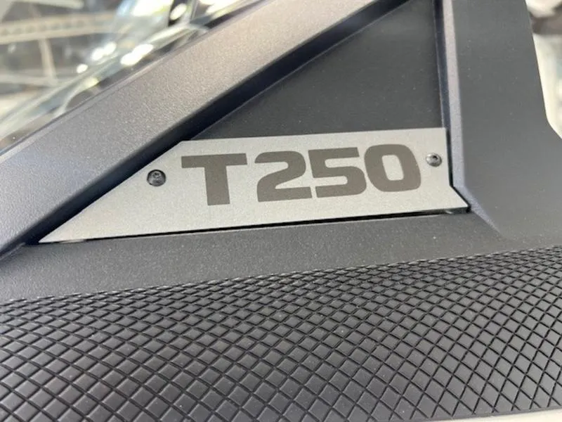 Slide: The Image of 2024 Axis T250 model badge on textured surface. - 6
