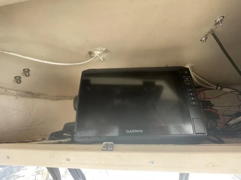 Slide: The Image of Garmin device installed on 2003 Grady-White Sailfish 282 boat dashboard. - 10