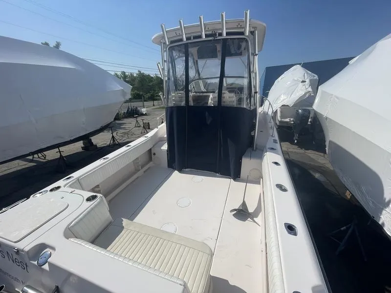 Slide: The Image of 2003 Grady-White Sailfish 282 boat with spacious deck and covered cockpit. - 6