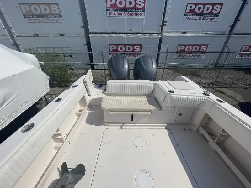 Slide: The Image of 2003 Grady-White Sailfish 282 boat interior with seating and dual engines. - 9