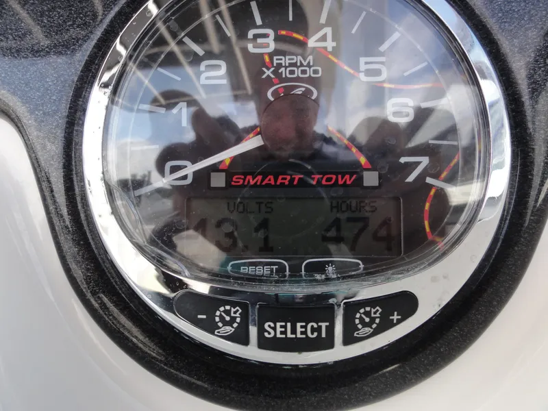 Slide: The Image of Close-up of 2009 Sea Ray 250 SLX tachometer displaying RPM and engine hours. - 13