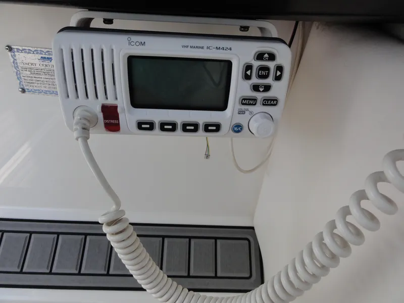 Slide: The Image of VHF marine radio on 2009 Sea Ray 250 SLX boat dashboard. - 16