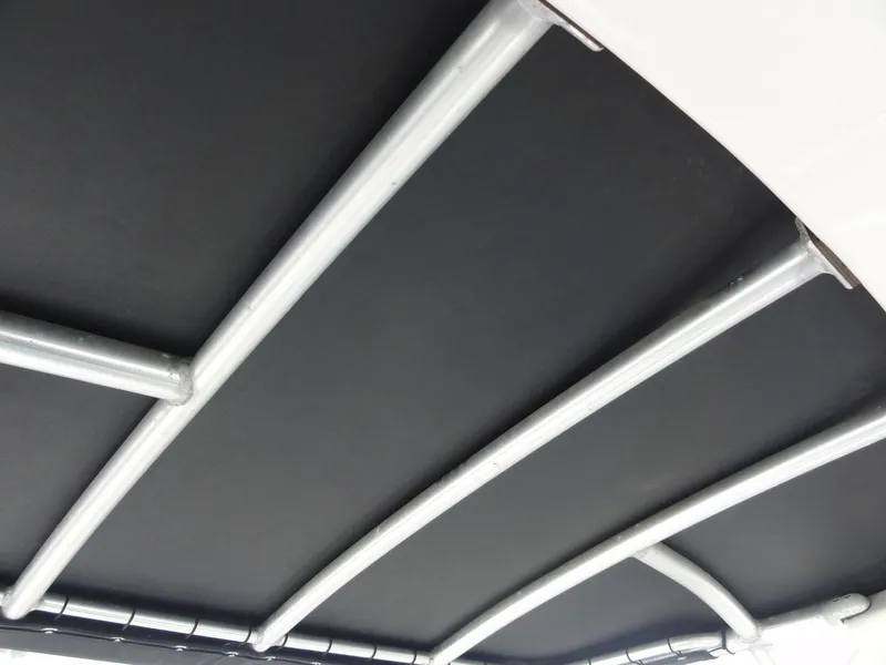 Slide: The Image of Bimini top frame of 2009 Sea Ray 250 SLX boat, featuring sturdy metal supports. - 18