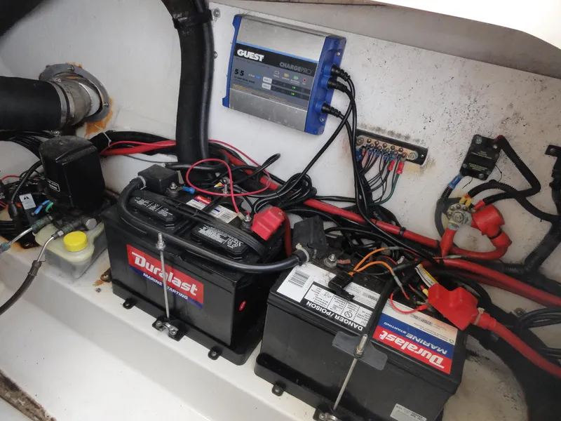 Slide: The Image of Battery compartment of a 2009 Sea Ray 250 SLX with Duralast marine batteries and wiring. - 21