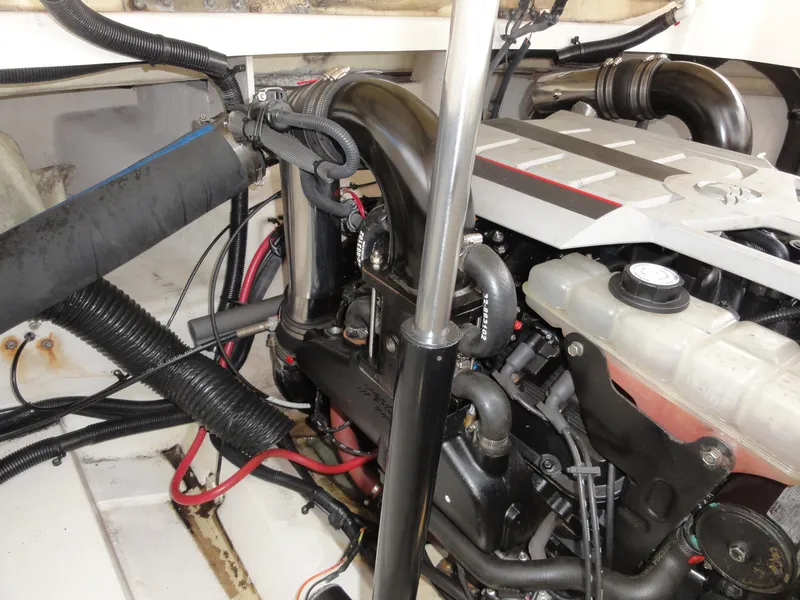 Slide: The Image of Engine compartment of a 2009 Sea Ray 250 SLX boat, showing detailed components and wiring. - 23