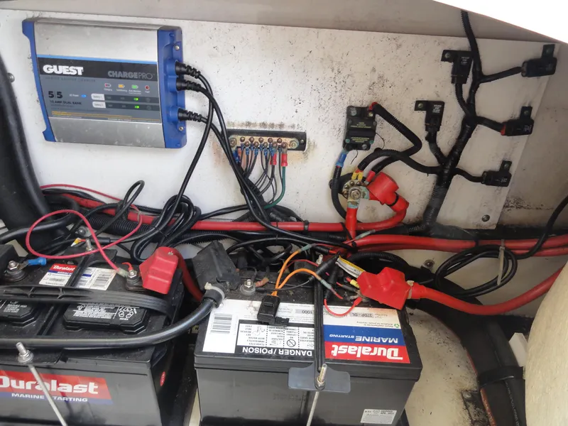 Slide: The Image of Electrical system of a 2009 Sea Ray 250 SLX with marine batteries and wiring. - 24