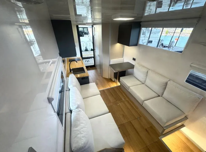 Slide: The Image of Modern interior of Navisyo Homes NV.08 houseboat, 2022 model, featuring sleek design and comfortable seating. - 10